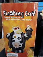Front of Flashing Cow box showing product name and graphics