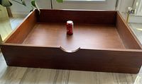 Top view of teak storage box with soda can for scale