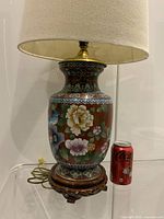 Full view of cloisonné lamp with shade and soda can for scale