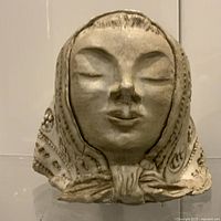 Front view of heavy vintage female bust with scarf