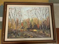 Full view of framed landscape painting