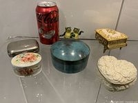 All six trinket boxes with soda can for scale
