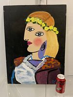 Front view of signed abstract oil portrait painting with soda can for scale