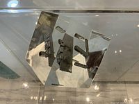 lucite cube angled view showing embedded metal pieces