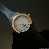 Front view of watch showing dial, bezel, and strap