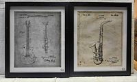 Both framed patent prints side by side, guitar left, saxophone right