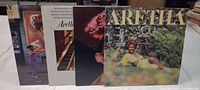 Four Aretha Franklin LPs upright showing front covers