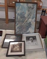 Group shot of all four framed pieces on table