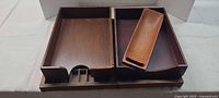 All four wooden items grouped: two paper trays, teak tray on top, printer’s tray beneath