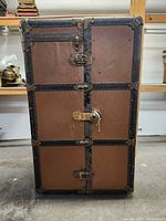 Front view of Atlas steamer wardrobe trunk showing latches and overall exterior