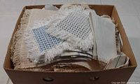 Box filled with assorted linens