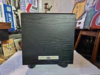 Front view showing JBL badge, LED indicators and cabinet finish