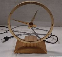 Front view of Jefferson Golden Hour clock showing glass dial, gold bezel and base