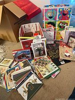 overall lot showing cards spread out, boxes, and gift bags