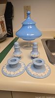 Group shot of glass candy dish, Wedgwood candle holders, salt and pepper shakers