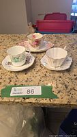 All three teacup and saucer sets on counter