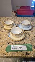 Three teacups with saucers showing full lot