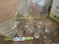 Group shot of all glass and crystal pieces on carpet