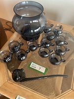 Full set showing punch bowl, twelve cups and ladle