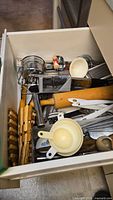 Drawer view of assorted kitchen tools