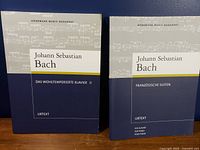 Front covers of both Bach piano music books showing titles and publisher