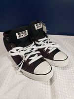 Full view of the pair showing color, style, laces, toe caps, hang tag