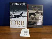 Front covers of both hardcover sports biographies