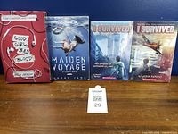 Front covers of the four trade paperback books