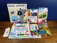 All six packaged craft items displayed together on table