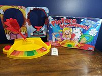 Game set with base, face masks, hand and box