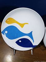 Front view of plate showing fish motif