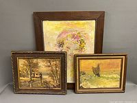 Front view of the three framed paintings