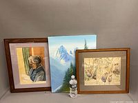 Group shot of all three paintings with water bottle for scale