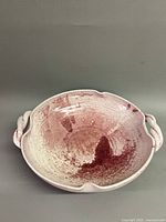 Top view of the signed A.R. Cole bowl showing glaze coloration and scalloped rim