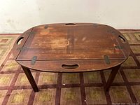 full view of hinged-top oval coffee table