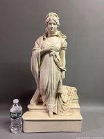 Front view with water bottle for scale