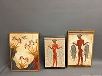 Front view of three chalkware plaques