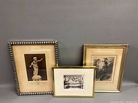 Three framed artworks side by side