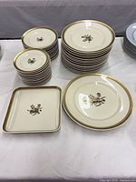 Stacks showing dinner plates, bread plates, salad plates, square dish and platter