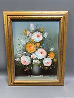 Full view of framed floral oil painting
