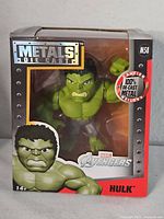 Front of boxed Hulk die-cast figure showing branding, character and size