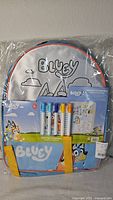 Front of sealed Bluey backpack with markers visible