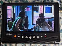 Television powered on displaying broadcast image