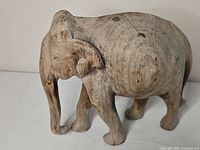 Left side view of wooden elephant carving