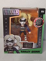 Front of sealed box showing Harley Quinn figure and branding