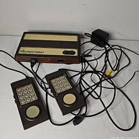 Intellivision Flashback console, two controllers, power adapter and AV cable displayed together