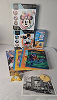 Entire lot with puzzles, snow globes, books, photo, name tag, watch