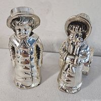 Front view of boy and girl figural napkin rings