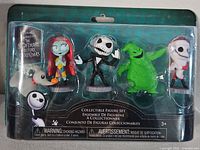 Front of sealed blister pack showing five figures