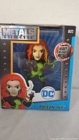 Front view of boxed Poison Ivy Metals Die Cast figure showing character and branding
